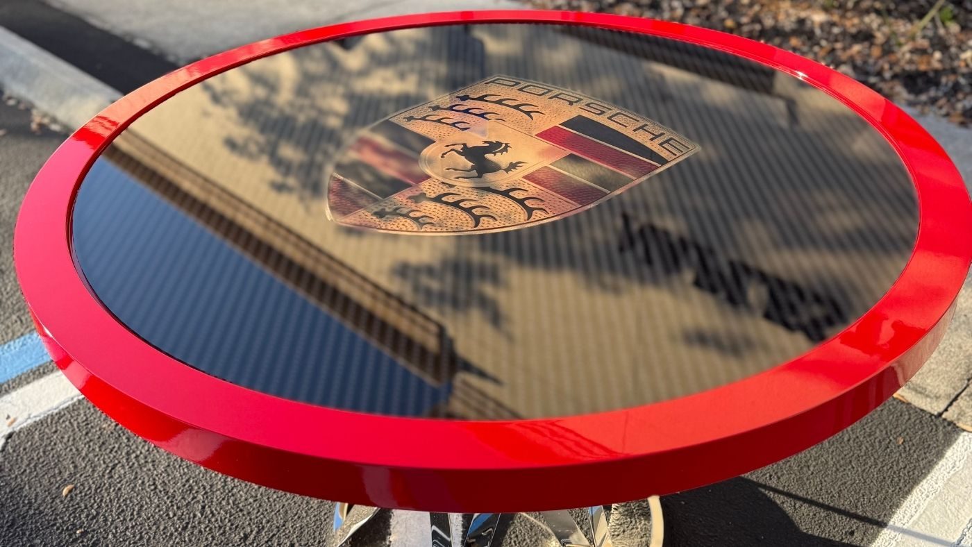 One of one illuminated Porsche glass art table with VIN and guards red by Dyer Design Glassworks