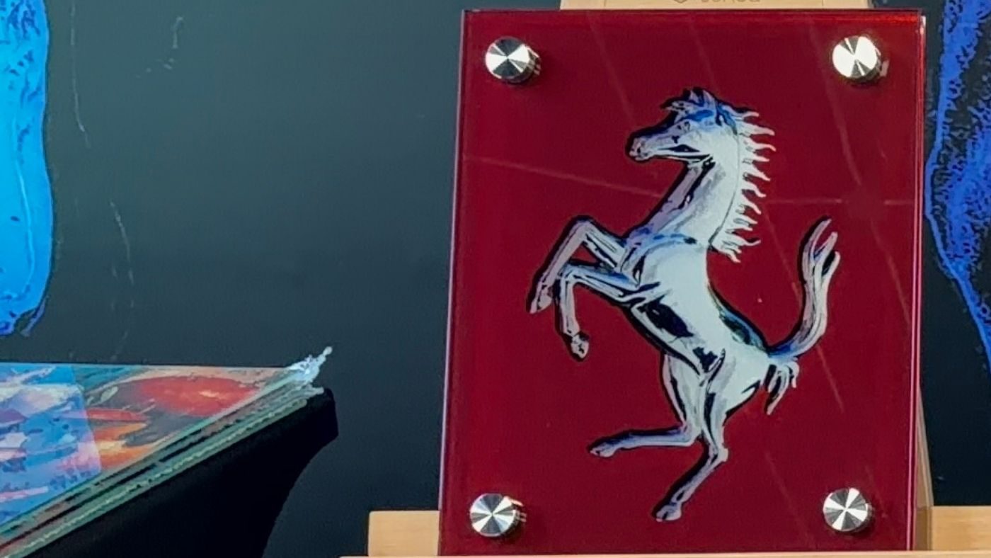 Custom illuminated glass Ferrari art, the prancing horse on red glass, by Dyer Design Glassworks