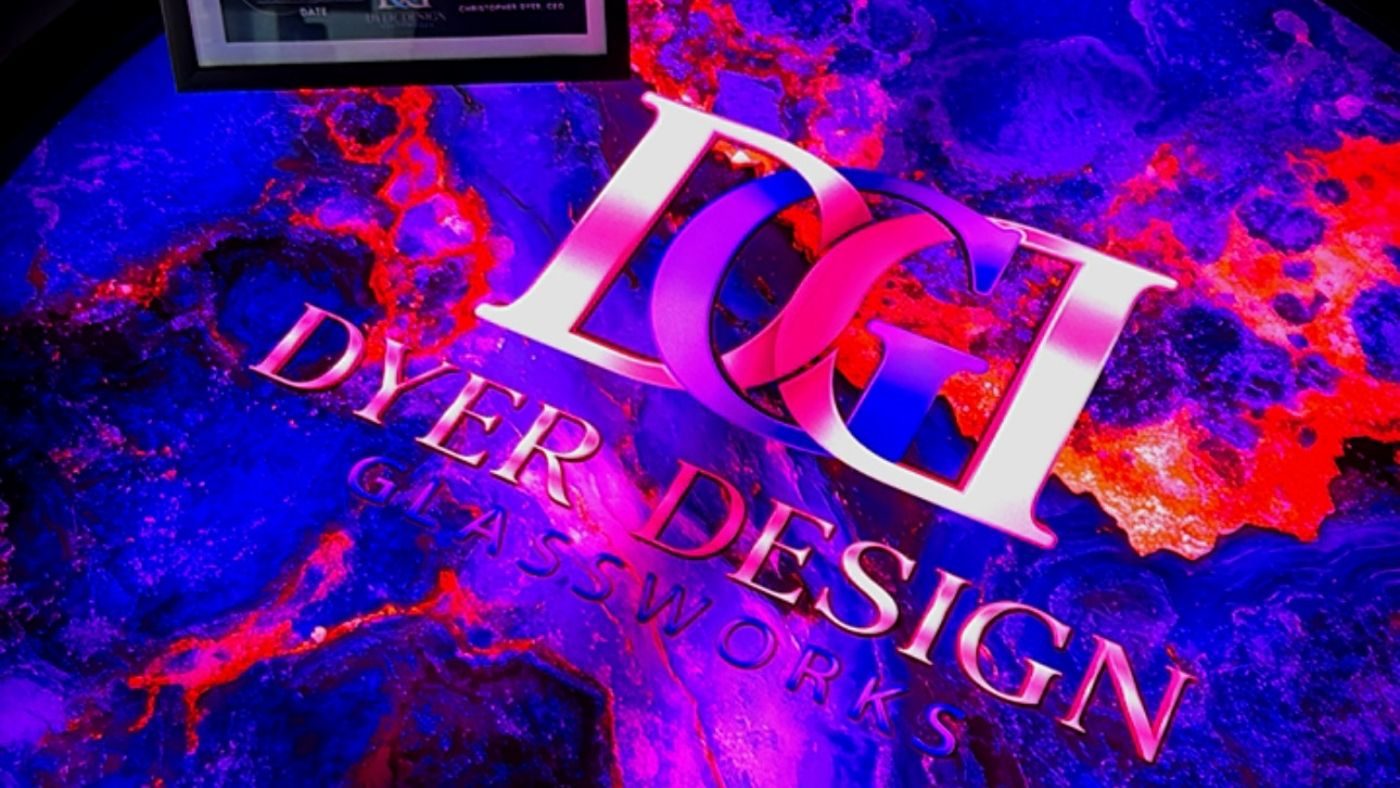 One of one illuminated glass table with a color shifting marbled top and the Dyer Design Glassworks mark
